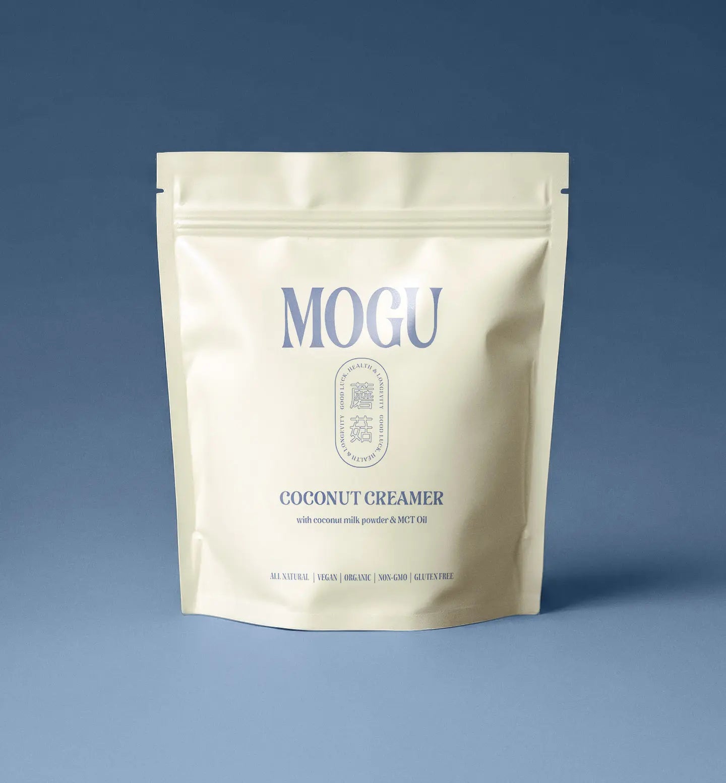 MOGU coconut creamer for energy, vitality and added creaminess to any drinks. MOGU Coconut creamer package on a blue background
