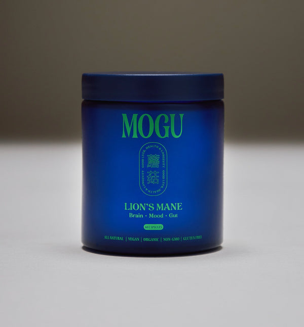 Lion's Mane Capsules in a Blue container with green text labeled 'MOGU Lion's Mane' on a gray background